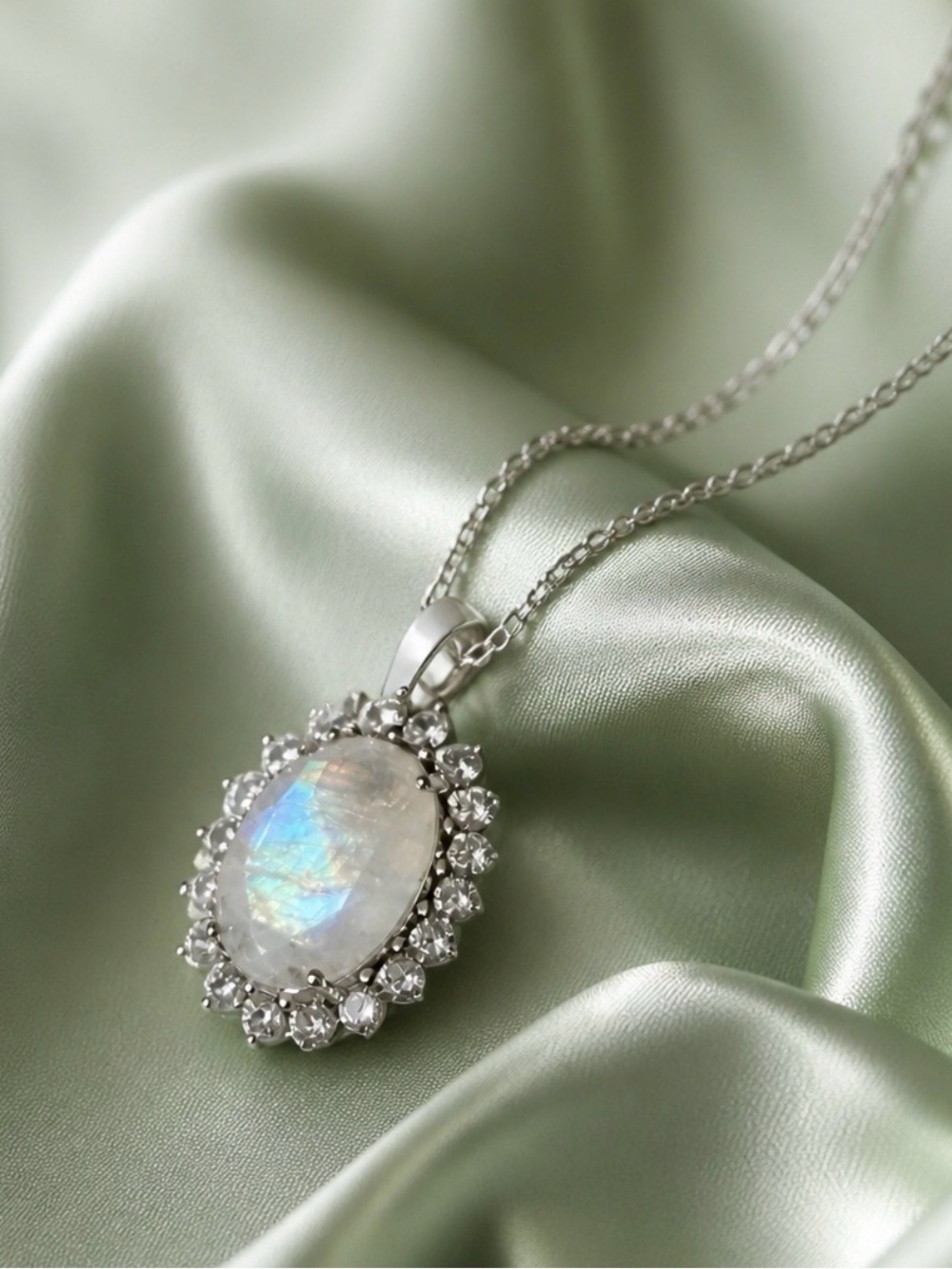 Large 13ctw Oval Moonstone surrounded by Austrian Crystals. S925. NEW!